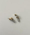 Coastal clip earrings with gold posts and silver oval links.