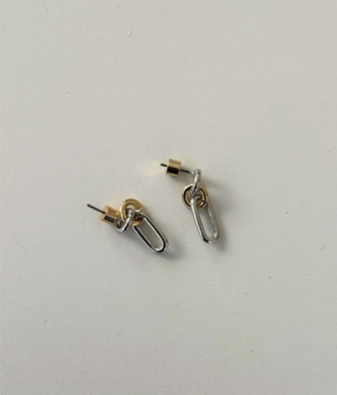 Coastal clip earrings with gold posts and silver oval links.