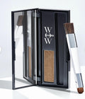 Open Color Wow Root Cover Up compact in light brown with mirror and dual-ended brush.