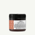 Davines Alchemic Conditioner Copper in a dark amber jar with a black lid and copper-patterned label.