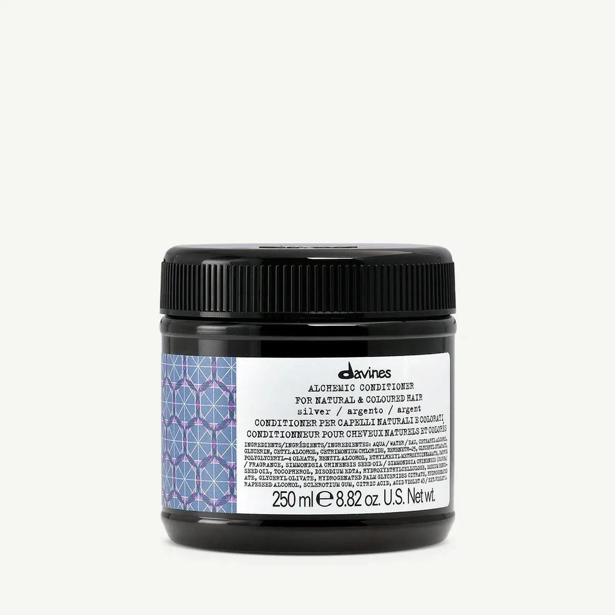 Davines Alchemic Conditioner Silver in a black jar with a textured lid and purple geometric label.
