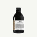 Davines Alchemic Chocolate shampoo in a sleek black bottle with a patterned label, 280ml.