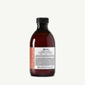 Davines Alchemic Copper Shampoo, 280ml, in a dark amber bottle with a white label and copper design.