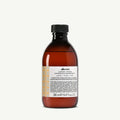 Davines Alchemic Shampoo Golden in a 280ml amber bottle with a black cap and white label.
