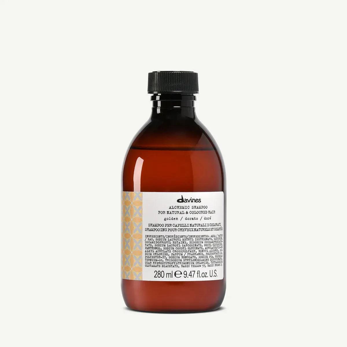 Davines Alchemic Shampoo Golden in a 280ml amber bottle with a black cap and white label.