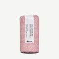 Davines Curl Building Serum, 250ml, wrapped in pink floral paper with a white label.