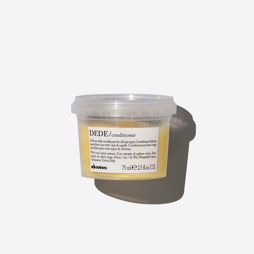 Davines DEDE Delicate Conditioner, 75ml, in a clear plastic tub with a white label and yellow text.