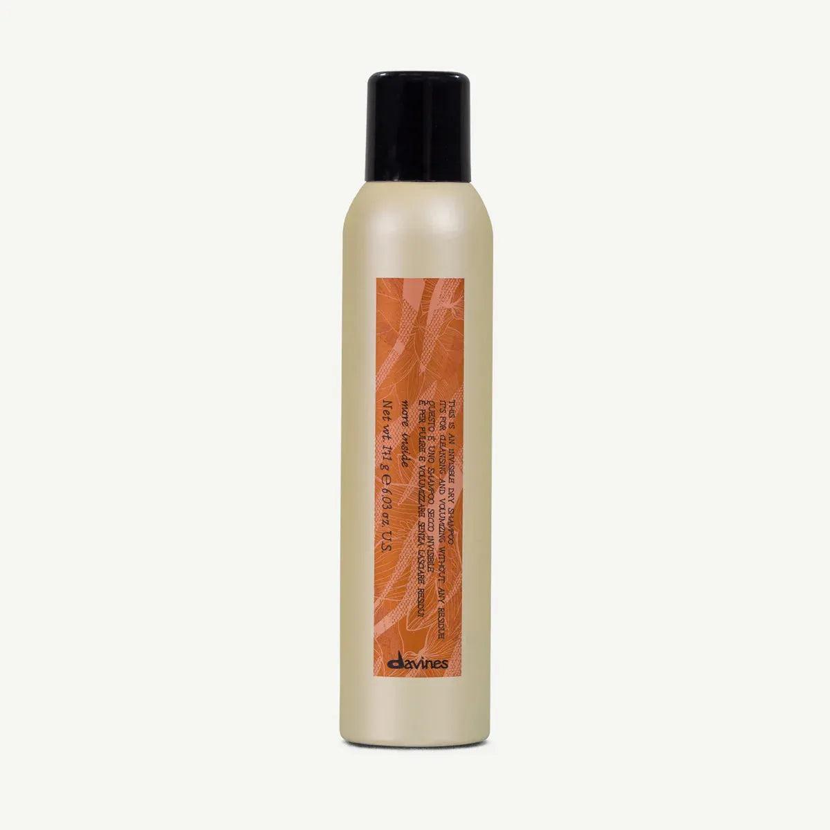 Davines Invisible Dry Shampoo in a tall, light beige 250ml aerosol can with a black cap and orange label.