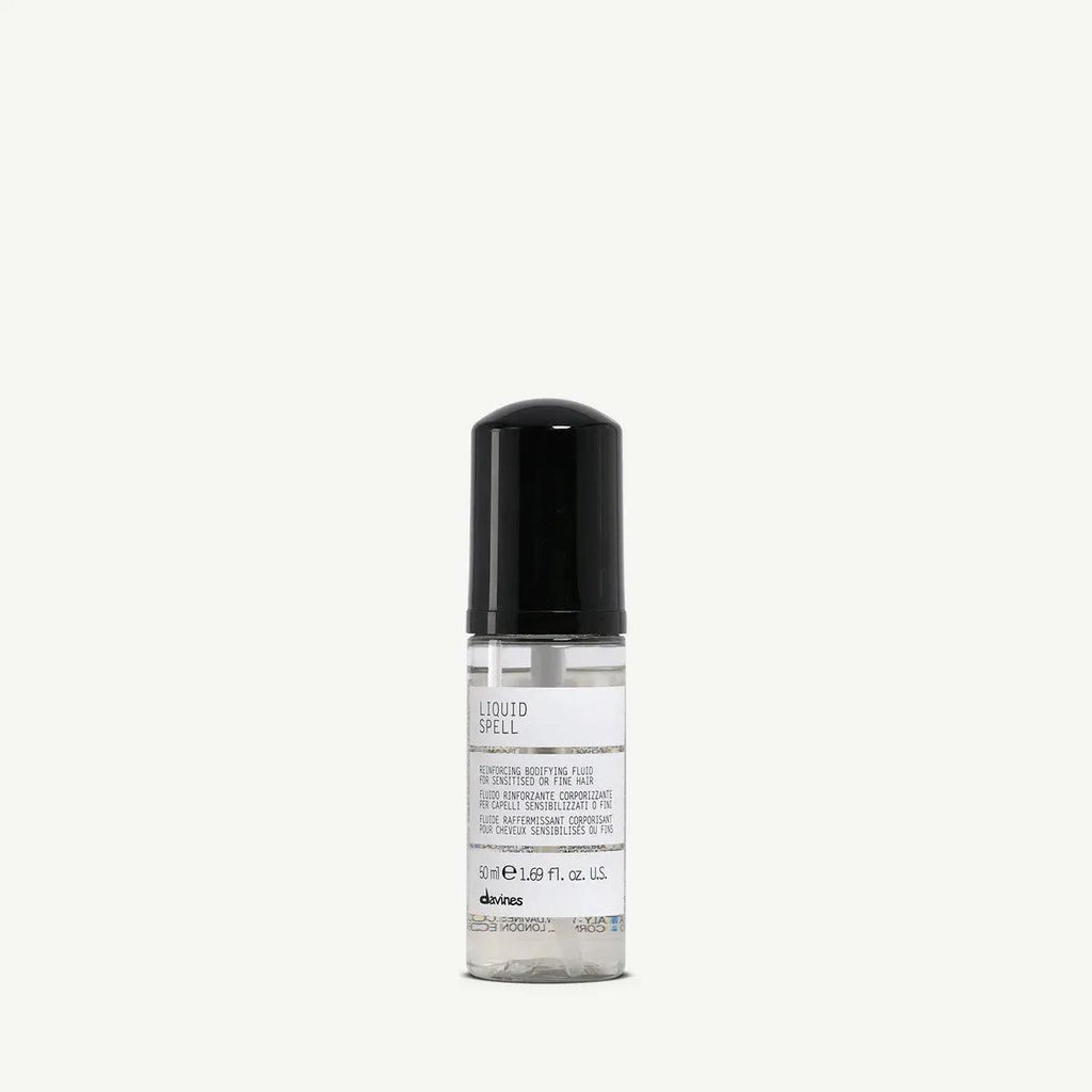 Davines Liquid Spell 50ml bottle with clear body, black cap, and white label.