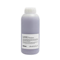 Davines LOVE Smooth Shampoo, 1000ml, in a light purple bottle with a white cap and label.