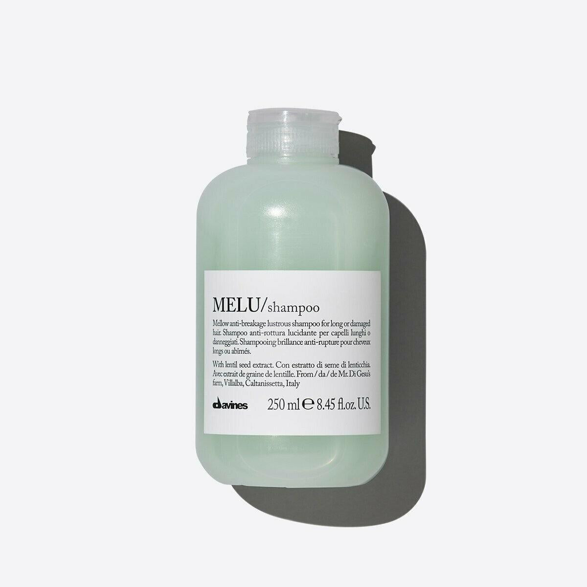 Davines MELU Shampoo, a 250ml light green bottle with a white label and cap, casting a shadow.