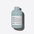 Davines MINU Shampoo, 250ml, in a light blue bottle with a white label, casting a shadow.