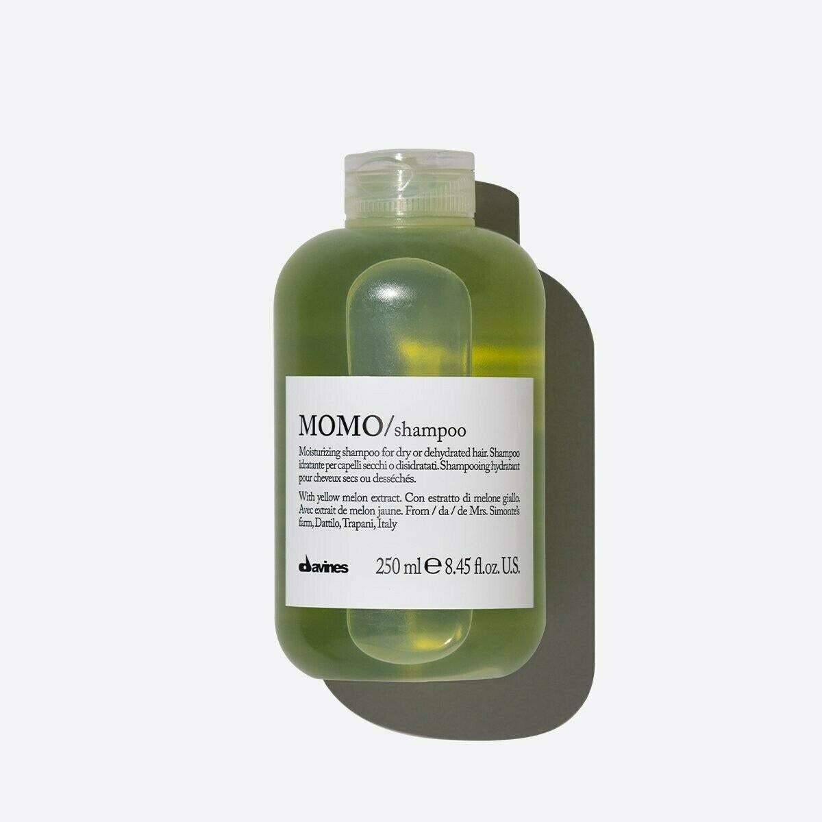 Davines MOMO Shampoo, 250ml, in a translucent green bottle with a white label and clear flip-top cap.