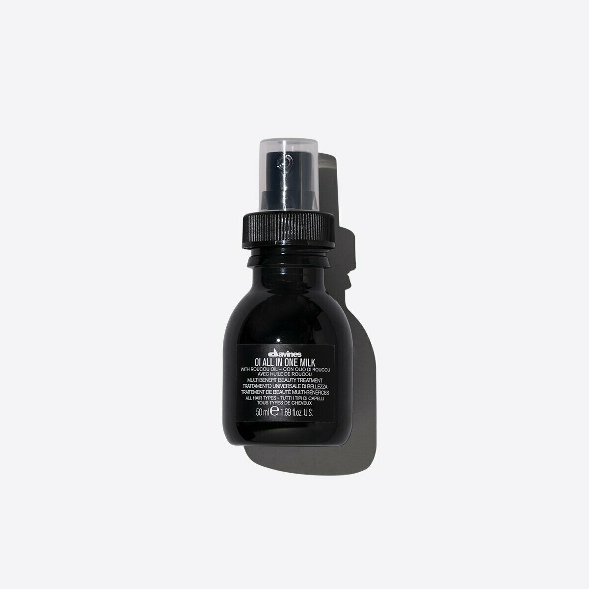 Davines OI All In One Milk, a 50ml black spray bottle with clear cap and white text.