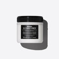 Davines OI Conditioner in a white 250ml jar with a black ribbed cap and label.