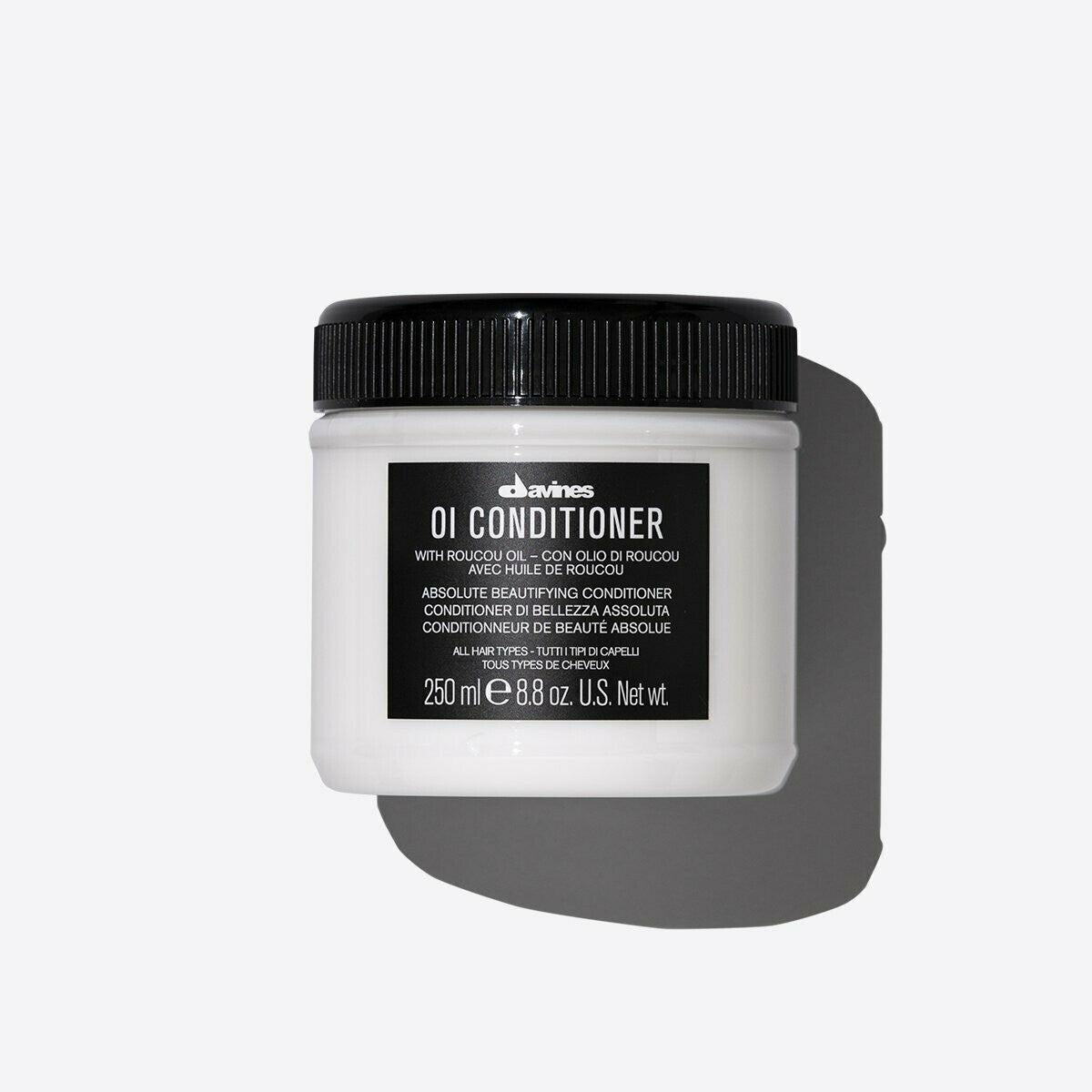 Davines OI Conditioner in a white 250ml jar with a black ribbed cap and label.
