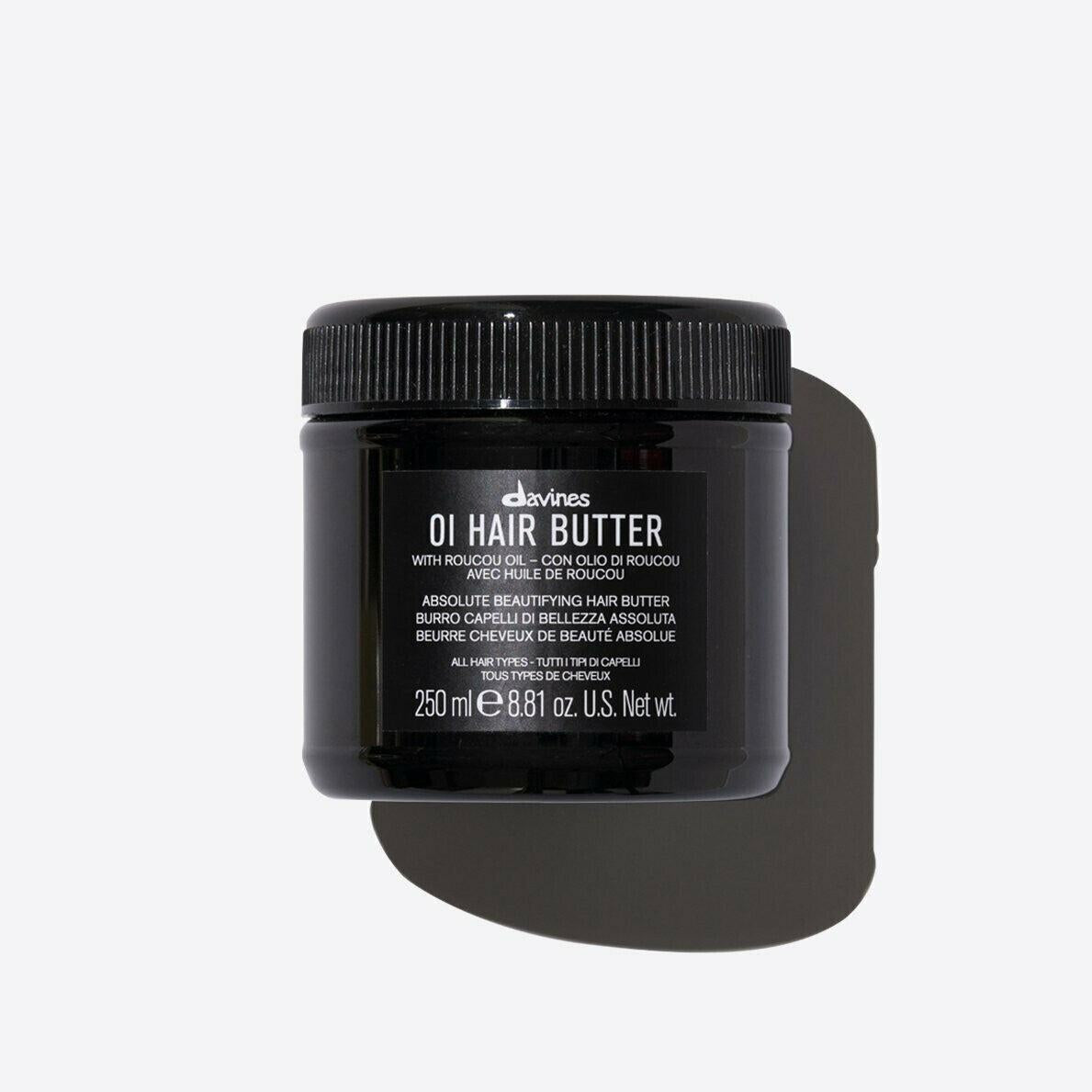 Davines OI Hair Butter in a black 250ml jar with a ribbed black screw-top lid.