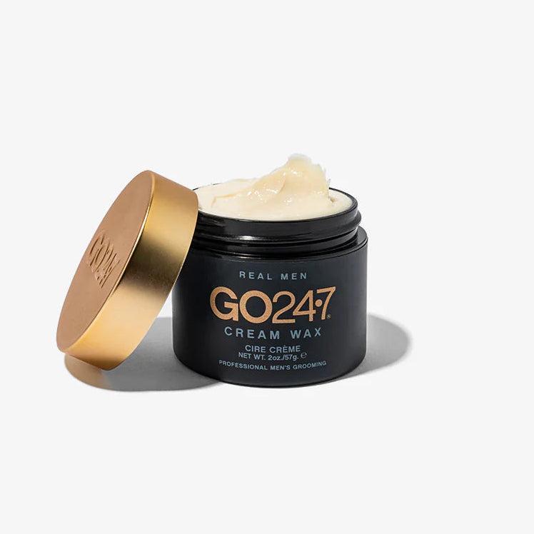 GO24•7 Cream Wax in a matte black 2oz jar with a gold lid, showing the light-colored wax inside.