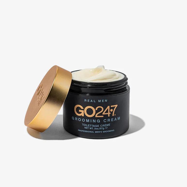 GO24•7 Grooming Cream in a black jar with a gold lid, showing the white cream inside.