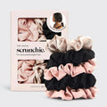 Kitsch 5-piece satin scrunchie set in blush pink, black, and champagne, with packaging.