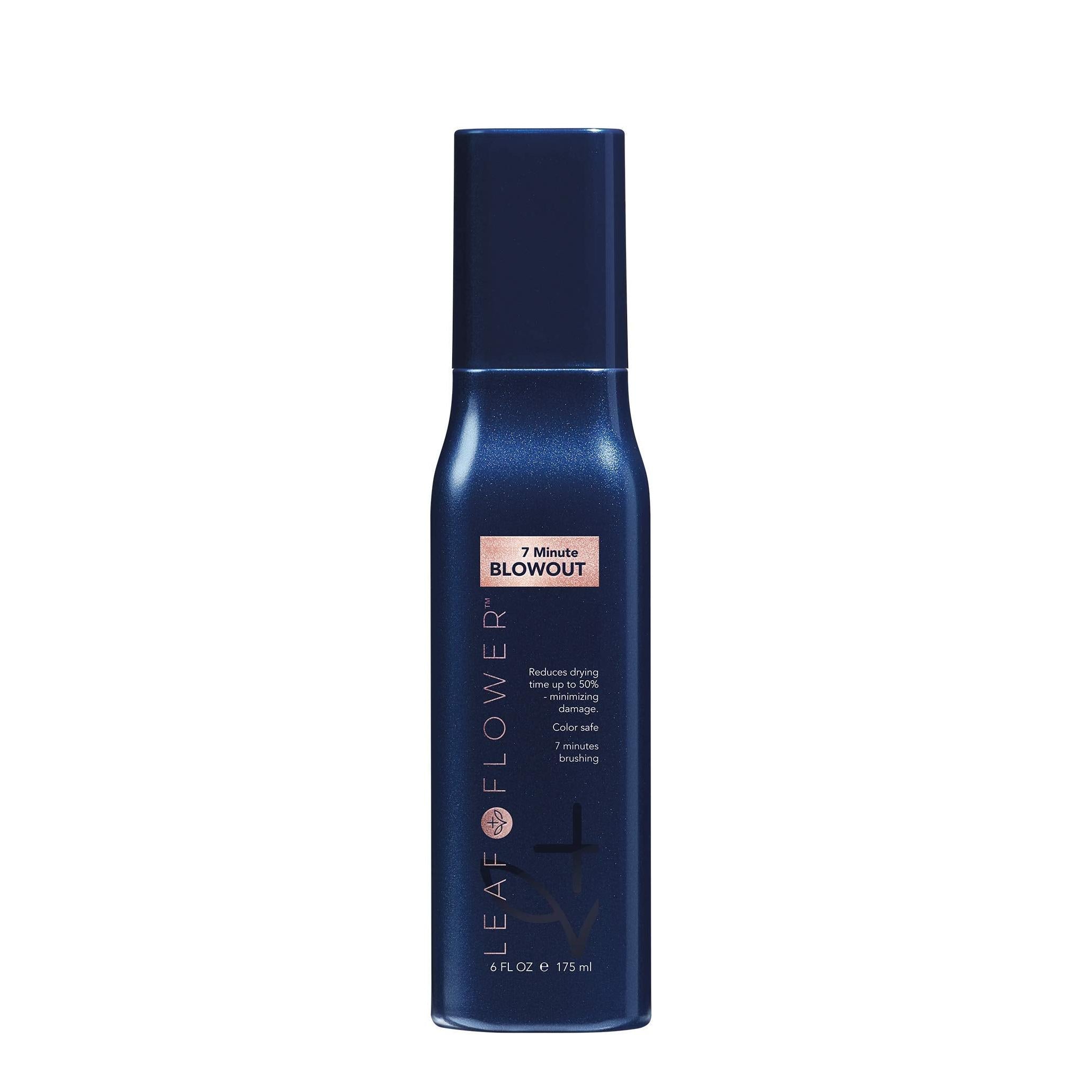 Leaf & Flower 7 Minute Blowout spray, a dark blue bottle with pink text and a sleek design.