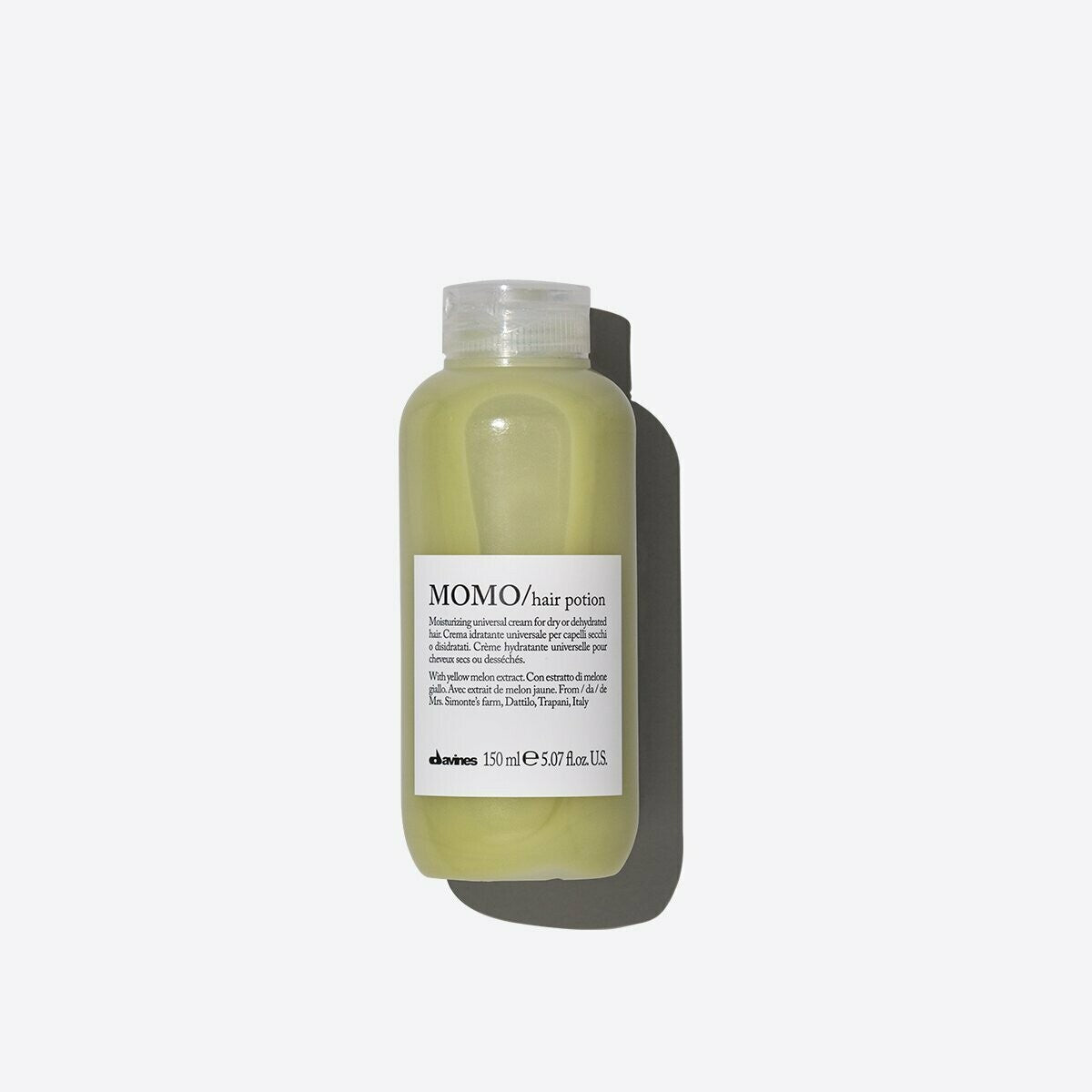 MOMO Hair Potion: light green 150ml bottle with white label on a white background.