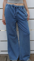 Denim blue washed knitted Nantucket Pant with elastic waist and drawstring, worn by a model.