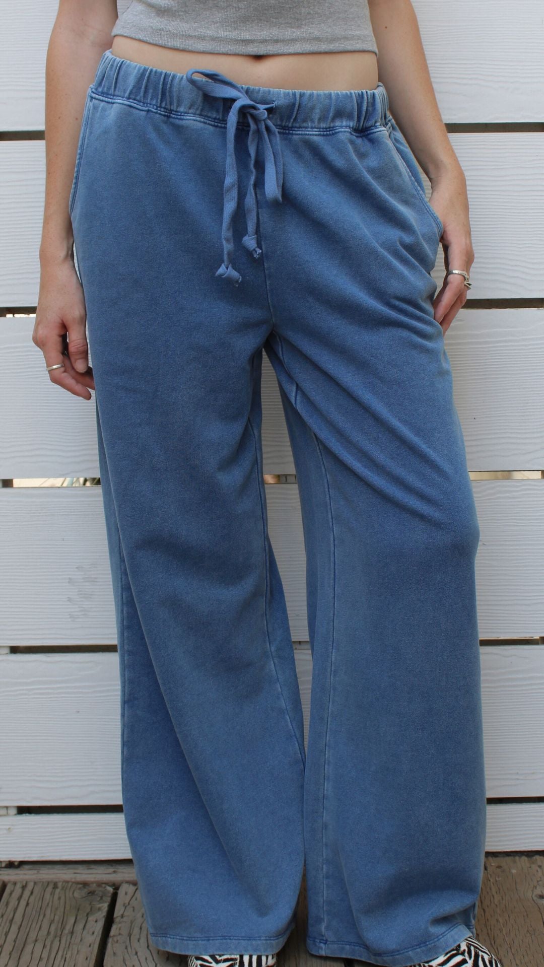Denim blue washed knitted Nantucket Pant with elastic waist and drawstring, worn by a model.
