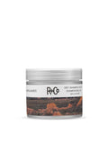 R+Co Badlands Dry Shampoo Paste in a clear jar with a white lid and desert landscape label, 2.2oz.