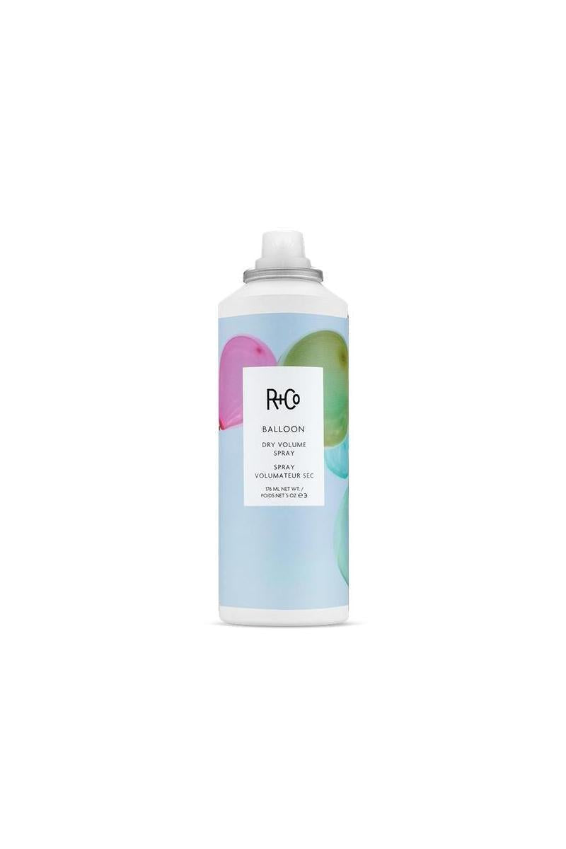 R+Co Balloon Dry Volume Spray, 5oz white aerosol can with light blue label and colorful balloon graphics.