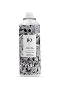 R+Co Foil Frizz & Static Control Spray in a crumpled silver can with a white label.
