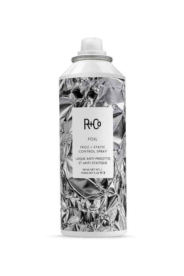 R+Co Foil Frizz & Static Control Spray in a crumpled silver can with a white label.
