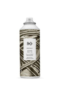 R+Co Freeway Defining Spray Gel, 5 oz, in a white aerosol can with a sepia-toned freeway interchange design.