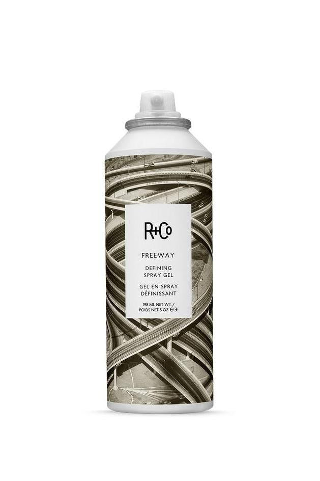 R+Co Freeway Defining Spray Gel, 5 oz, in a white aerosol can with a sepia-toned freeway interchange design.