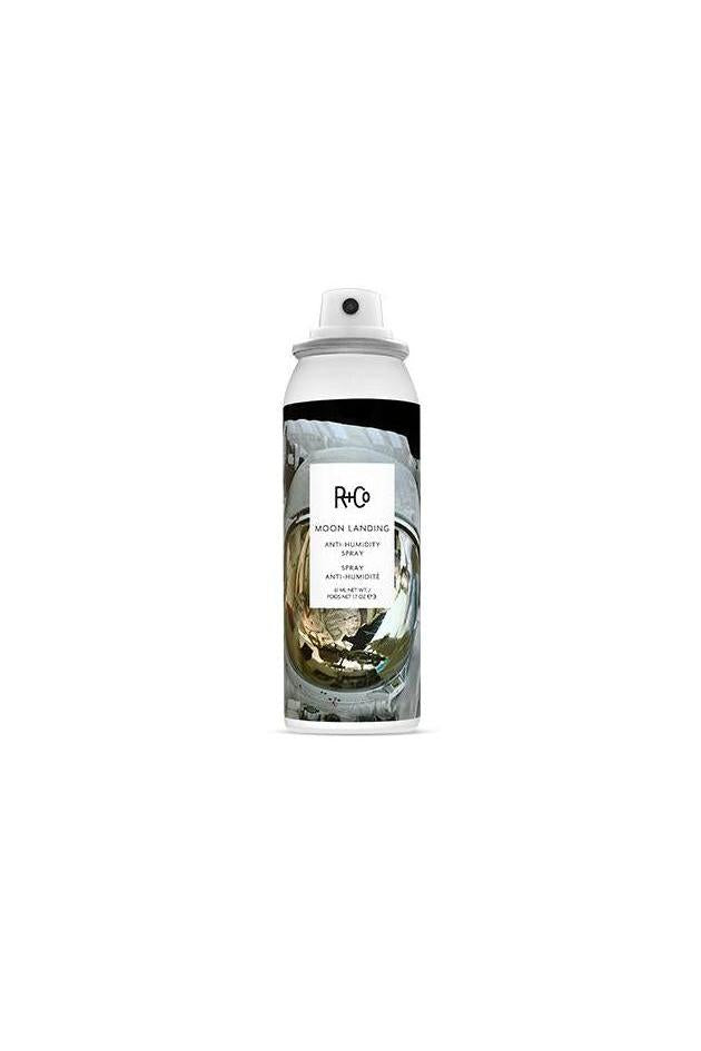 White R+Co Moon Landing Anti-Humidity Spray MINI, 1.7 oz, featuring an astronaut helmet design.
