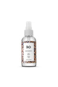 R+Co Rockaway Salt Spray in a clear 4 oz bottle with a white label featuring a beach crowd design.