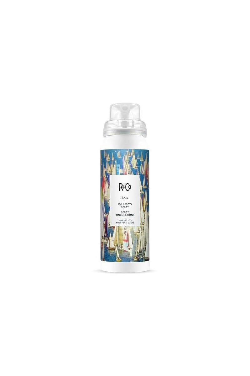White R+Co Sail Soft Wave Spray MINI bottle with a colorful sailboat design and clear cap.