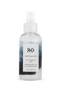 R+Co Spiritualized Dry Shampoo Mist, 4.2 fl oz clear bottle with white pump and abstract blue label.