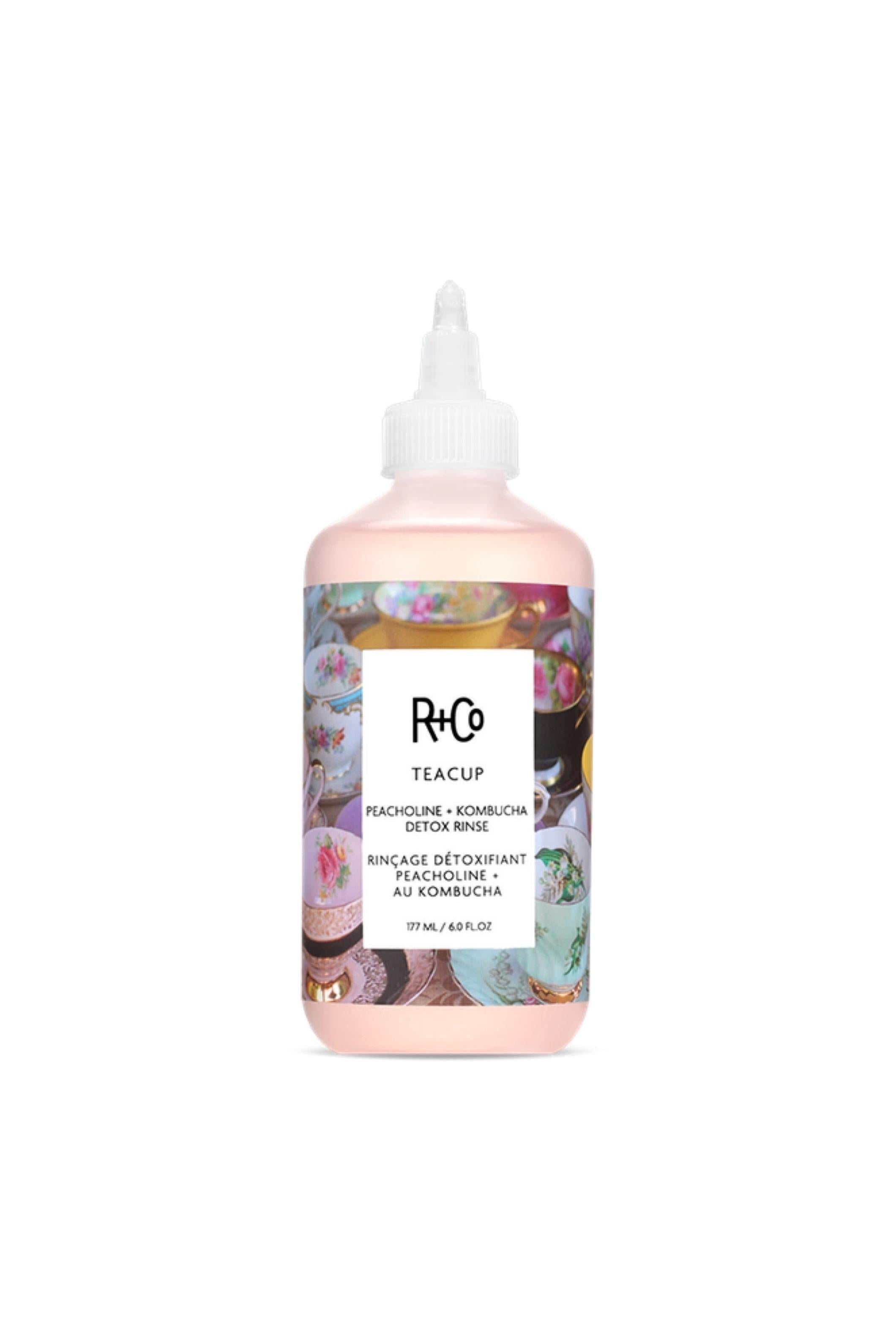 R+Co Teacup Peachouli + Kombucha Detox Rinse in a 6 fl.oz light pink bottle with a white nozzle and teacup label.