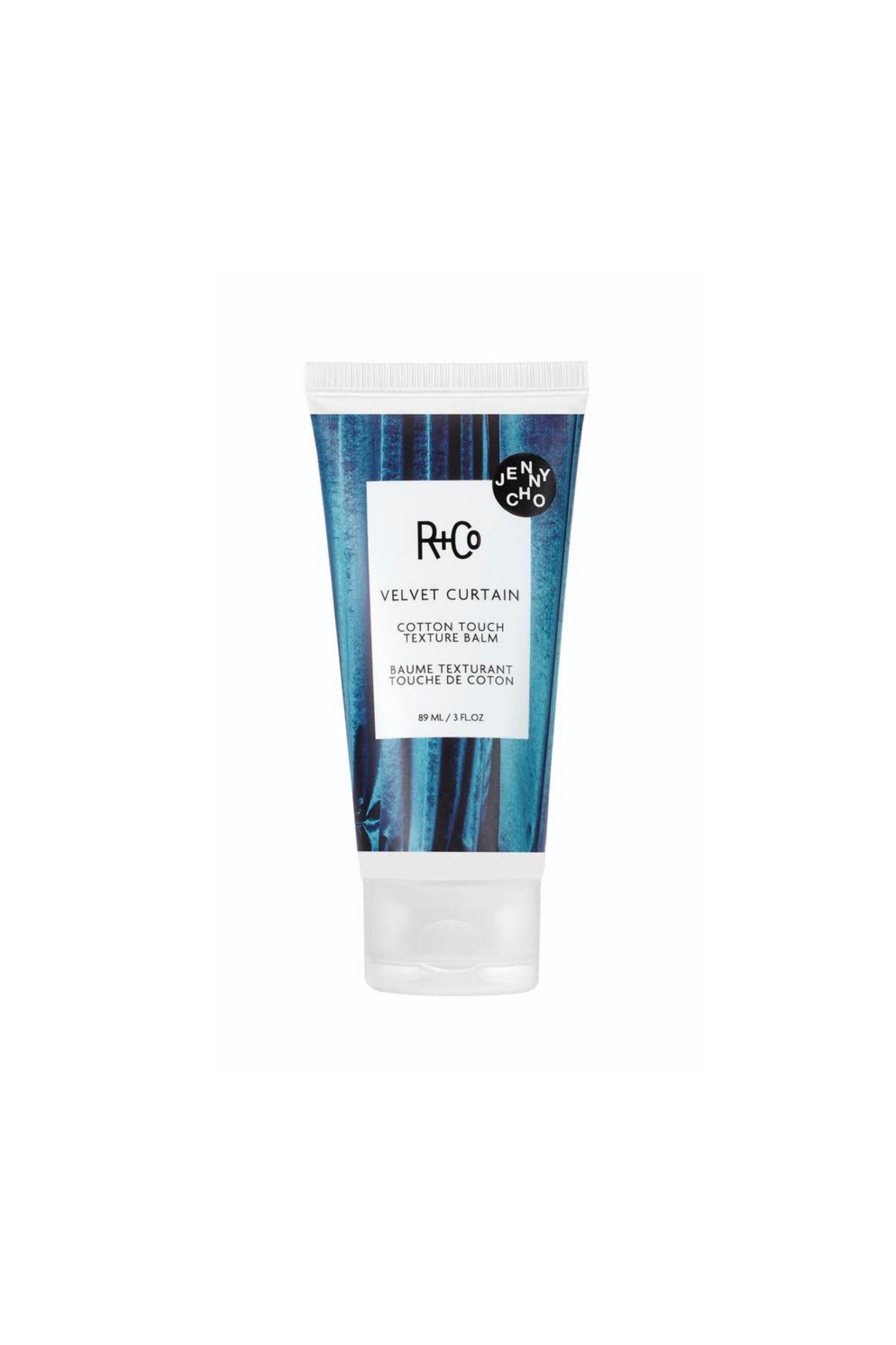 R+Co Velvet Curtain Cotton Touch Texture Balm in a blue and black tube with white cap, 3oz.