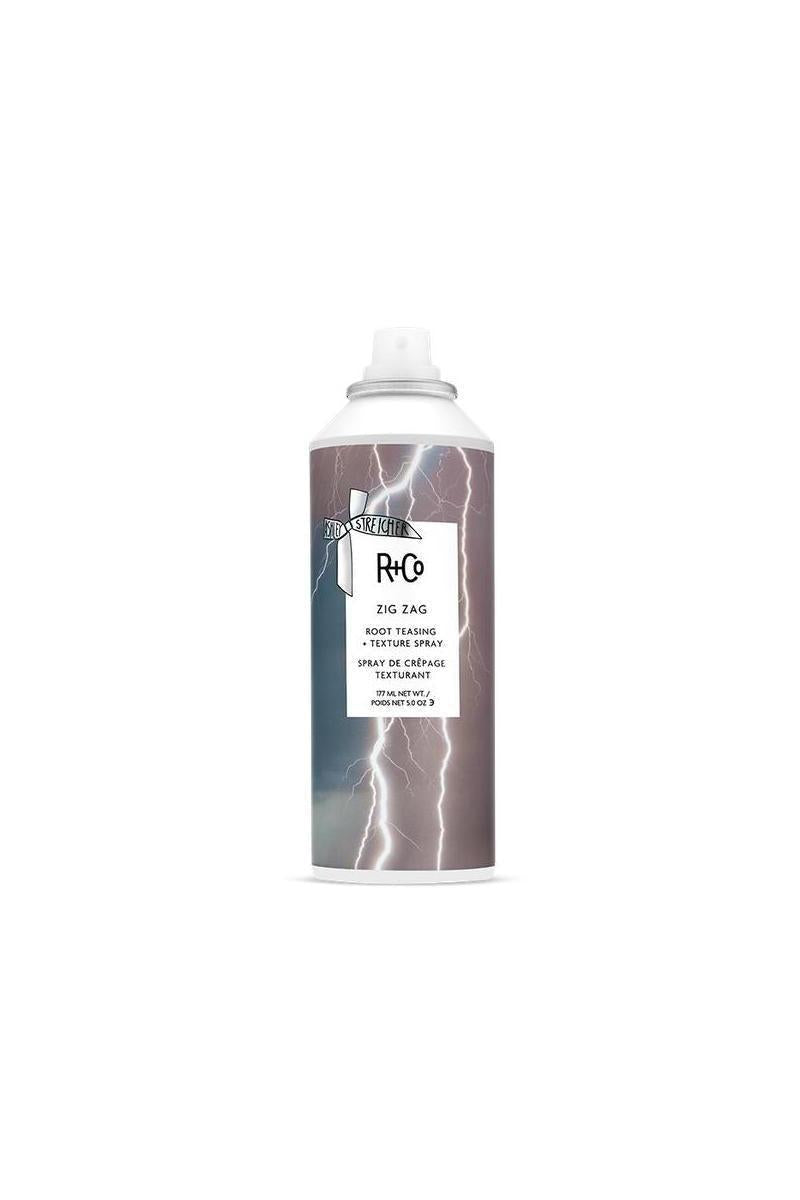 R+Co Zig Zag Root Teasing & Texture Spray in a 5 oz white aerosol can with lightning bolt design.