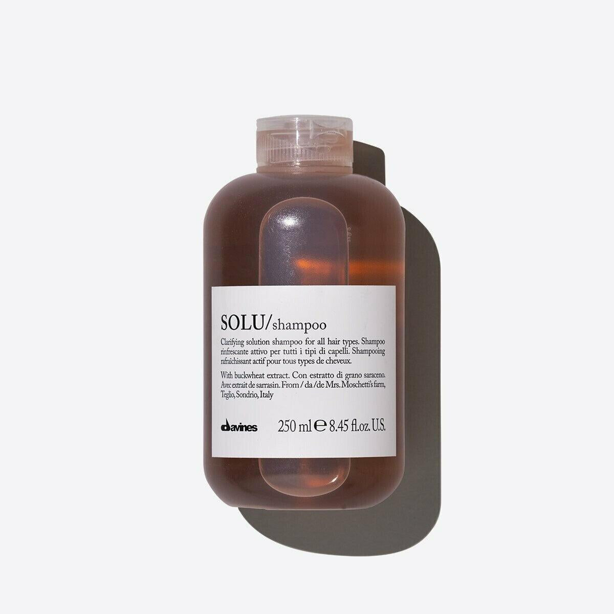 Davines SOLU Shampoo, 250ml, in a clear brown bottle with a white label and clear cap.