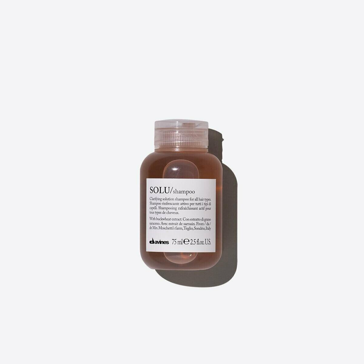 SOLU Shampoo 75ml, a small, clear brown bottle with a translucent cap, casting a shadow.