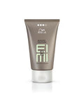 Wella EIMI Rugged Texture matte texturizing paste in a 75ml olive green tube with a white cap.